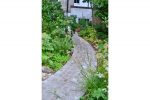 thumb of cruvy path made of sandstone setts