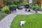 thumb of the family cat explores the new garden